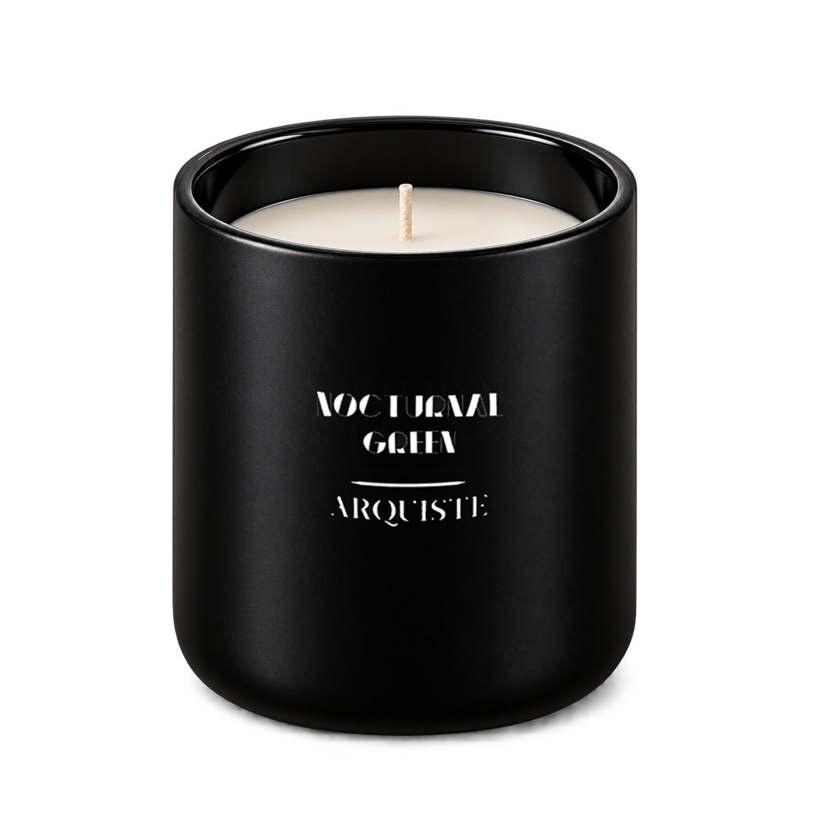 A matte black glass jar candle with a single white wick, featuring white printed text that reads 'NOCTURNAL GREEN' and 'ARQUISTE' on the front, set against a plain white background.