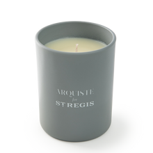 Load image into Gallery viewer, Gray candle in a container with &#39;Arquiste for St. Regis&#39; branding on a white background