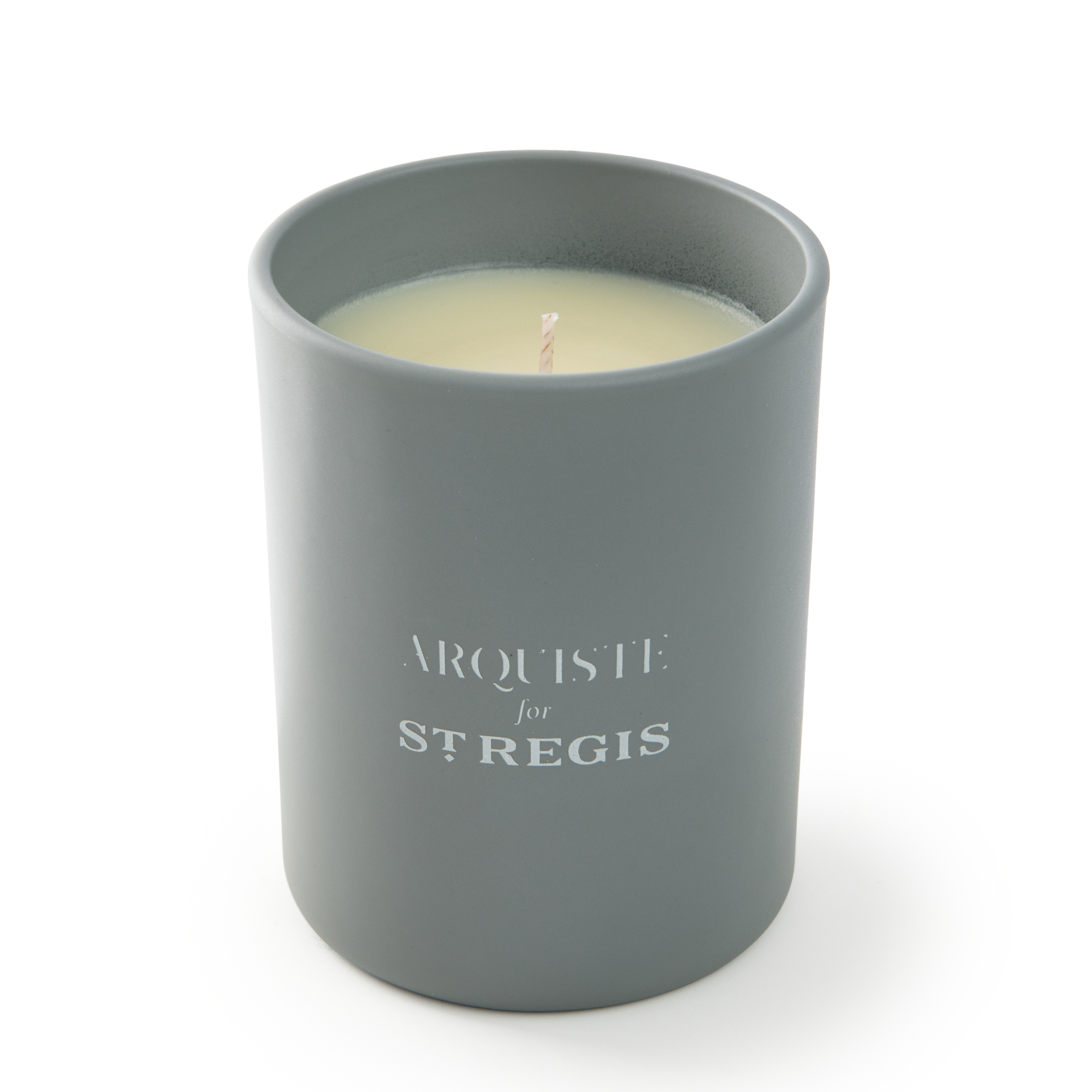 Gray candle in a container with 'Arquiste for St. Regis' branding on a white background