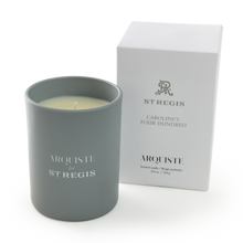 Load image into Gallery viewer, Gray candle with &#39; Arquiste for St. Regis&#39; branding next to a white box on a white background