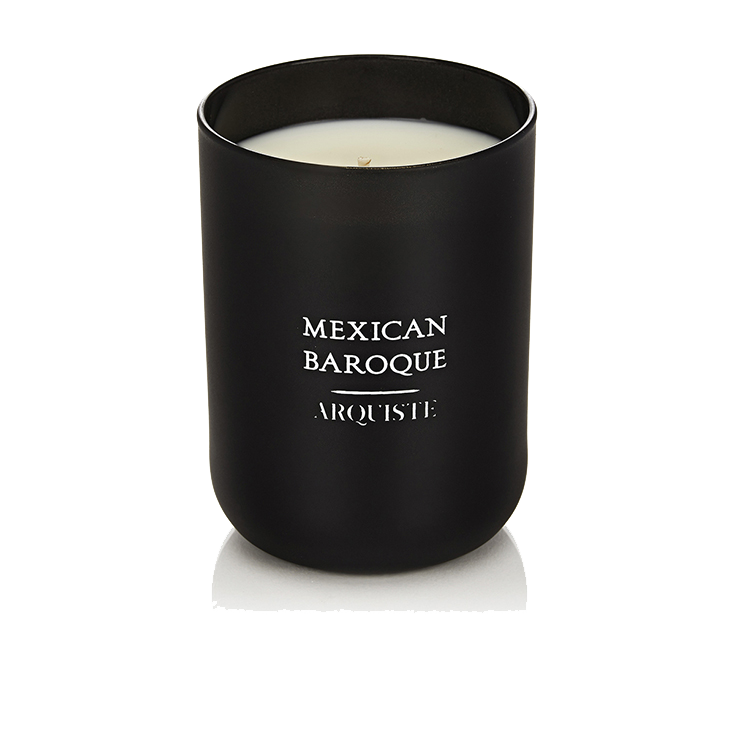 Black candle with 'Mexican Baroque Arquiste' branding on a white background