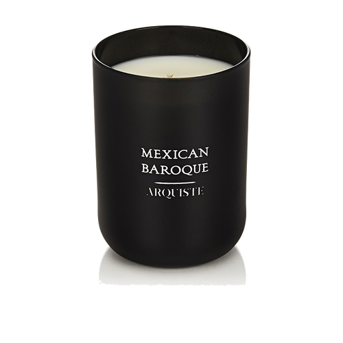 Black candle with 'Mexican Baroque Arquiste' branding on a white background