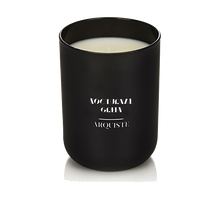 Load image into Gallery viewer, Black candle with &#39;Nocturnal Green Arquiste&#39; branding on a white background