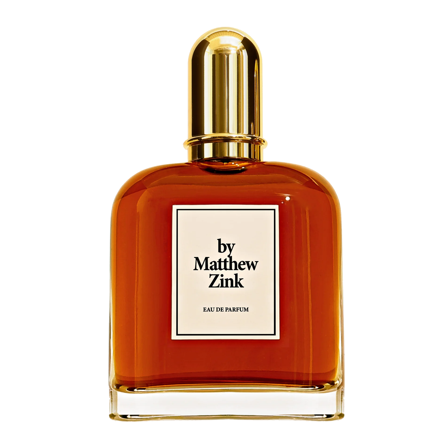 Perfume bottle with gold cap and 'by Matthew Zink' label on a white background