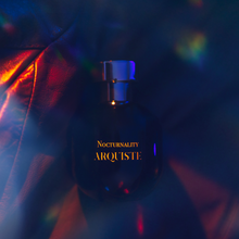 Load image into Gallery viewer, Arquiste Nocturnality perfume bottle with colorful light effects