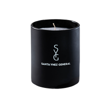 Load image into Gallery viewer, Black candle with &#39;Santa Ynez General&#39; logo on a white background