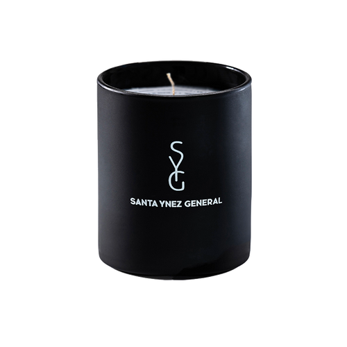 Black candle with 'Santa Ynez General' logo on a white background